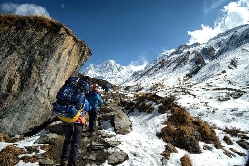 photo of person carrying backpack